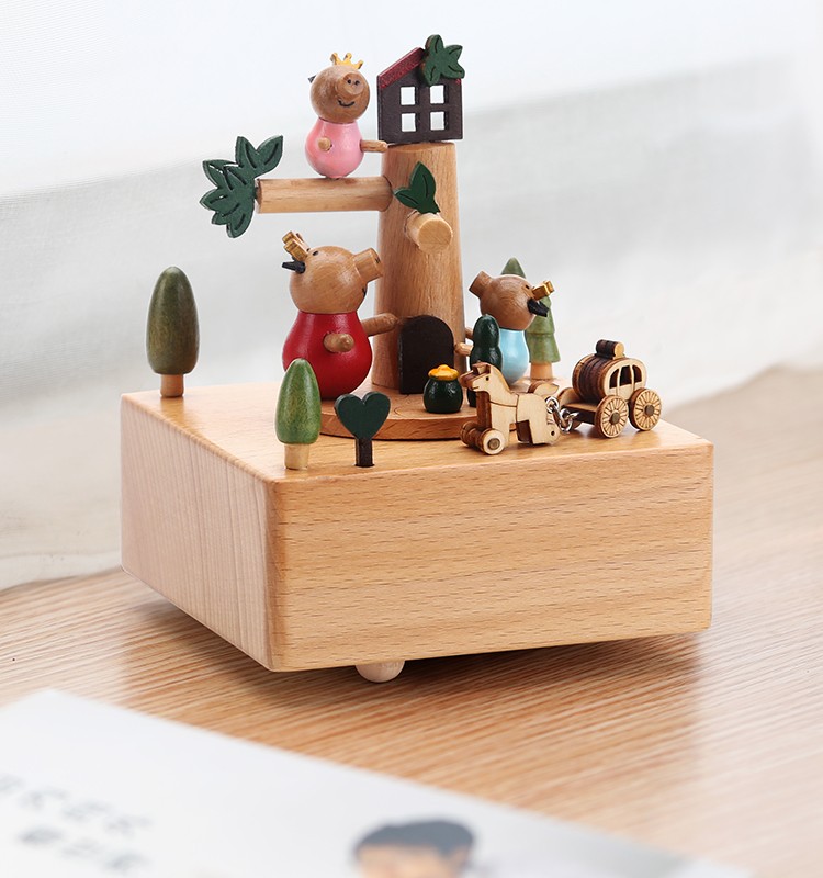Wooden music box with piglets