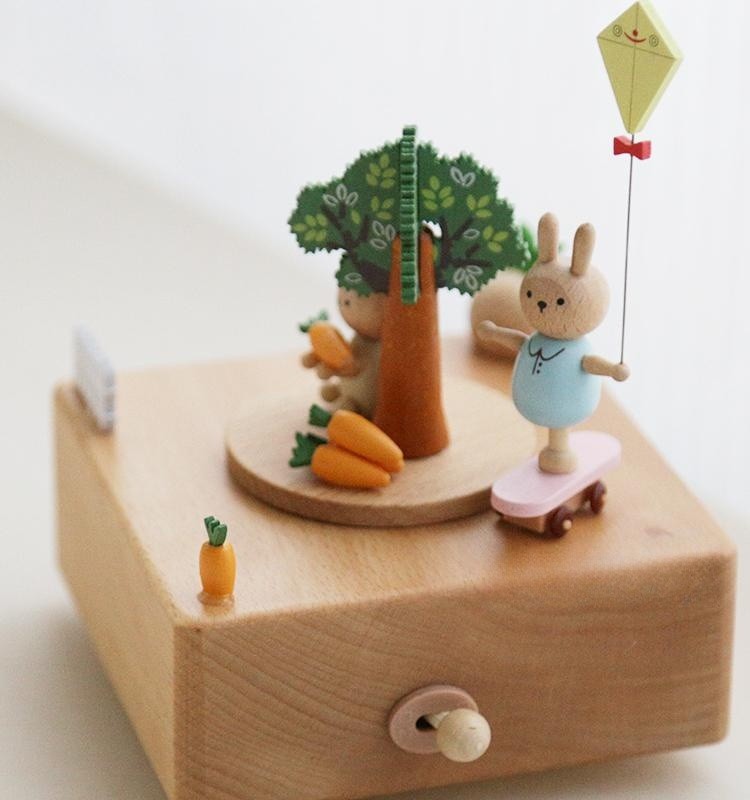 Wooden music box with rabbit-carrot shape