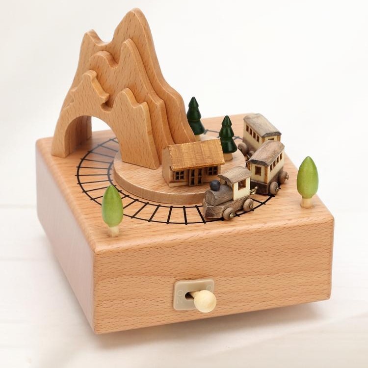 a wooden music box with beautiful scene