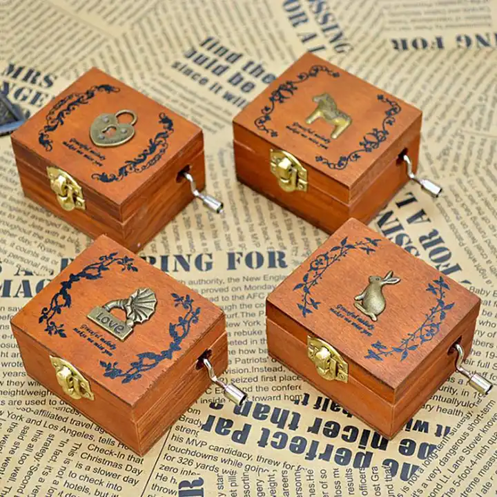 four wooden music boxes
